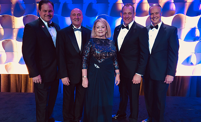 The 2020 Leadership Team of Cindi Bulla, Travis Kessler, Marvin Jolly, Russell Berry, and Tray Bates pose before the Installation Dinner at the 2019 Texas REALTORS® Conference in Fort Worth.